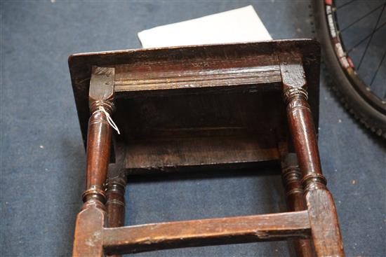 A 17th century oak joynt stool, incised with the initials W. R. 1ft. 7in. H.1ft 9in.